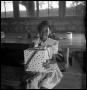 Photograph: [Sue Antoinette Emory Holding a Birthday Present]