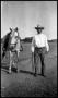Photograph: [Cowboy Leading Horse]