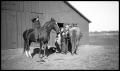 Photograph: [Cowboys and Children With Two Horses]