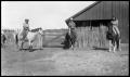 Photograph: [Family on Horseback in Front of a Barn]