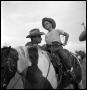 Photograph: [Boy Atop a Horse with a Man Nearby]