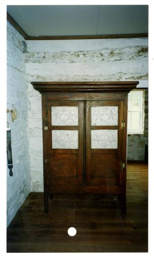 Primary view of object titled '[Photograph of an Armoire in the Pound House]'.