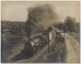 Thumbnail image of item number 1 in: '[Photograph of a Train Rolling down the Tracks]'.