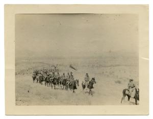 [Photograph of Soldiers Riding in a Long Line]