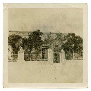 Primary view of object titled '[Photograph of Building with Fence]'.