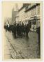 Primary view of [Photograph of Allied Soldiers Escorting Prisoners Through a Street]