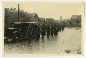 Primary view of object titled '[Photograph of Allied Soldiers Marching Down a Street in Wernigerode, Germany]'.