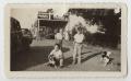 Photograph: [Photograph of Three Boys Playing on the Side of a Road]