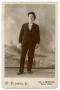Photograph: [Portrait of a Man Wearing a Suit and Hat]