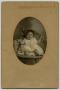 Photograph: [Portrait of a Baby in a Wicker Chair]