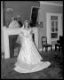 Photograph: Baker Folse Wedding - Bride in front of fireplace