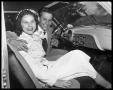 Photograph: [Bride and Groom in Car]