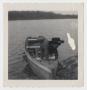 Primary view of [Photograph of David Kinser Bending Over in a Boat]