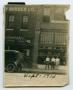 Photograph: [Photograph of Three Men by the Davis-Turney Automobile Co. Building]