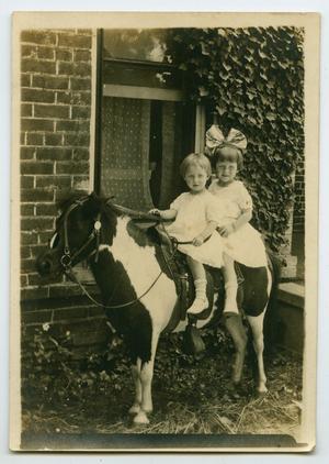 Primary view of object titled '[Photograph of Two Unknown Girls on a Pony]'.