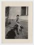 Photograph: [Photograph of Jimmy Arnold with his Dog]