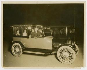 Primary view of object titled '[Photograph of Lee Turney Driving an Automobile]'.