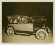 Photograph: [Photograph of Lee Turney Driving an Automobile]