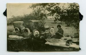 Primary view of object titled '[Photograph of an Unknown Woman on a Picnic Blanket]'.