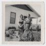 Photograph: [Photograph of Two Unknown Women by a House]
