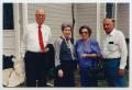 Photograph: [Photograph of Four Individuals at a House]