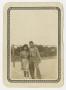 Photograph: [Photograph of Man and Woman Posing at Tennis Courts]