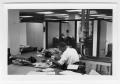 Photograph: [Man Working at Desk at Beaumont Enterprise #31]