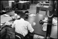Photograph: [Man Working at Desk at Beaumont Enterprise #22]