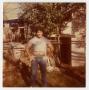 Thumbnail image of item number 1 in: '[Photograph of a Man Standing in a Yard]'.