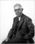 Photograph: [Albert Peyton George seated, with his left hand in his pants pocket]