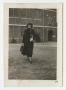 Photograph: [Photograph of Woman Outside Building]