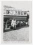 Photograph: [Photograph of Woman Outside McMurry College Bus]