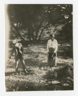Primary view of object titled '[Photograph of Robert and Gypsy Ted Wylie in their Garden]'.