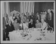 Primary view of [Group of men dining at a Houston hotel]