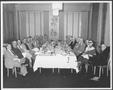 Primary view of [Albert Peyton George and a group of men in the dining room of a Houston hotel]