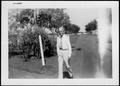 Photograph: [Albert Peyton George walking down the ranch house main driveway]