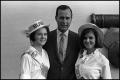 Photograph: [George Bush Posing With Two Women]