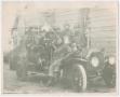 Photograph: [Firefighters on Fire Engine with a Bell]