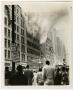 Photograph: [Crowd Watches Smoking Neiman-Marcus Building]