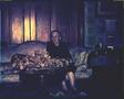 Photograph: [Mamie Davis George seated on a floral print sofa]