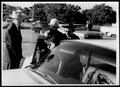 Photograph: [Photograph of Mamie Davis George as she is entering her car]