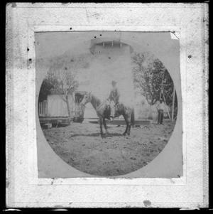 Primary view of object titled '[Photograph of J.H.P. Davis on horseback]'.
