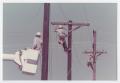 Photograph: [Linemen working on electrical poles]
