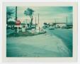 Primary view of [Signs in front of gas station on S. Elm Street]