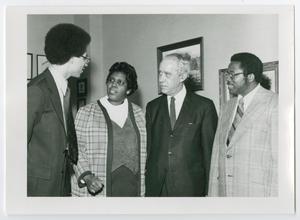 Primary view of object titled '[Donald V. Watkins, Barbara Jordan, Dean Thomas Christopher, and Fred D. Gray Meeting in an Office]'.