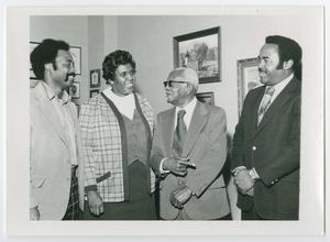 Primary view of object titled '[John England Jr., Barbara Jordan, Dr. A. G. Gaston, and Chris McNair Meeting in an Office]'.