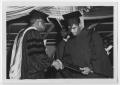 Photograph: [Two Men Shake Hands at the Texas Southern University Commencement]