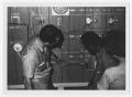 Photograph: [An Instructor Teaches Two Boys About Circuits]