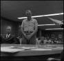 Photograph: [Photograph of Ham Vance Standing in Front of Courtroom]