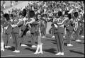 Photograph: [WFHS Cheerleaders and Marching Band on Field]